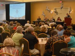 audience and panel at 2009 conference